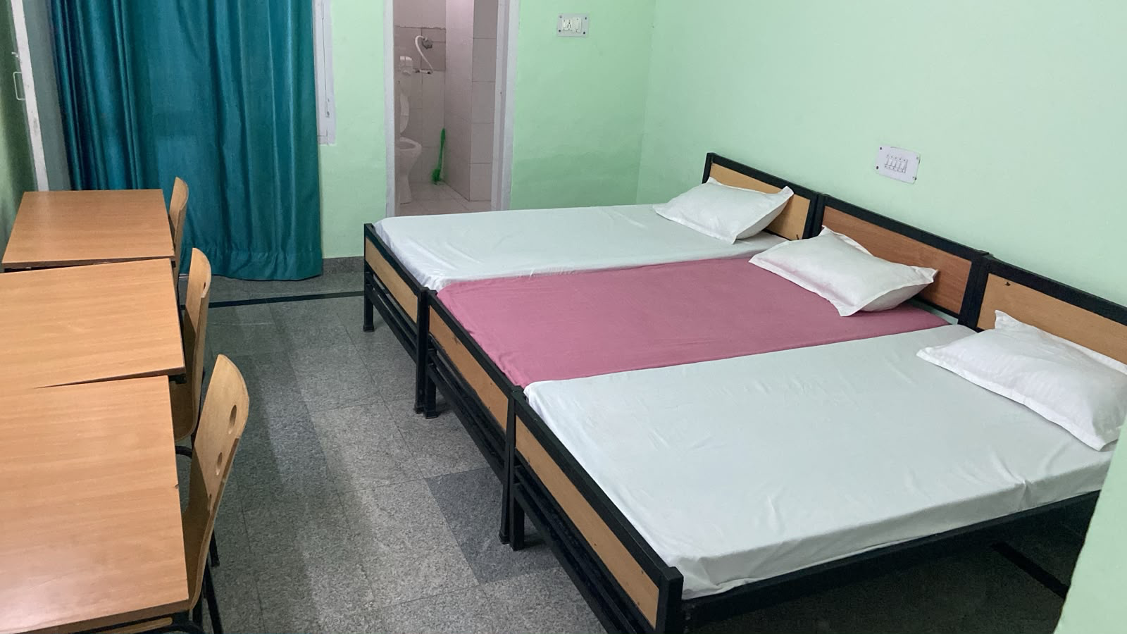 A furnished student hostel room